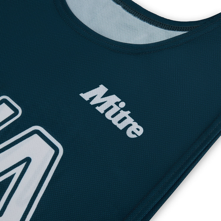 Front ¾ right view of the Mitre Netball Pro Training Bib Set Green and Tidal Teal