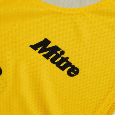 Front ¾ right view of the Mitre Netball Pro Training Bib Set Yellow